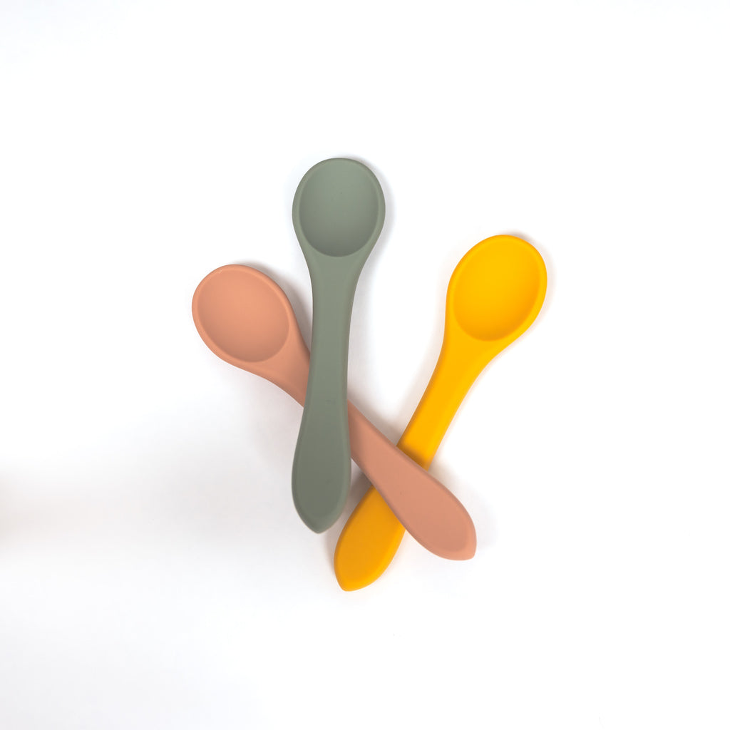 image of three 100% food grade silicone toddler sized spoons in terracotta sage and mustard yellow