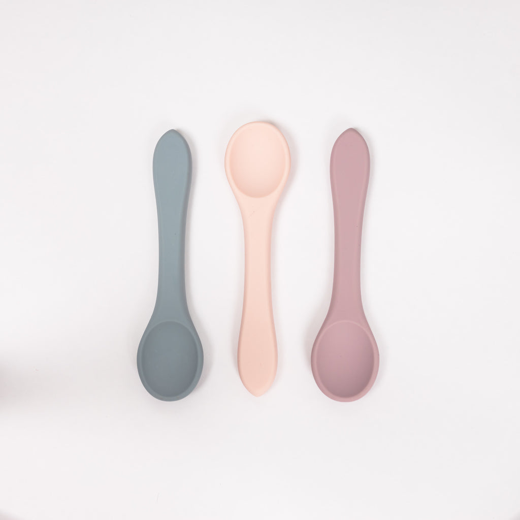 image of three toddler sized spoon using 100% food grade silicone in pale blue mauve and blush