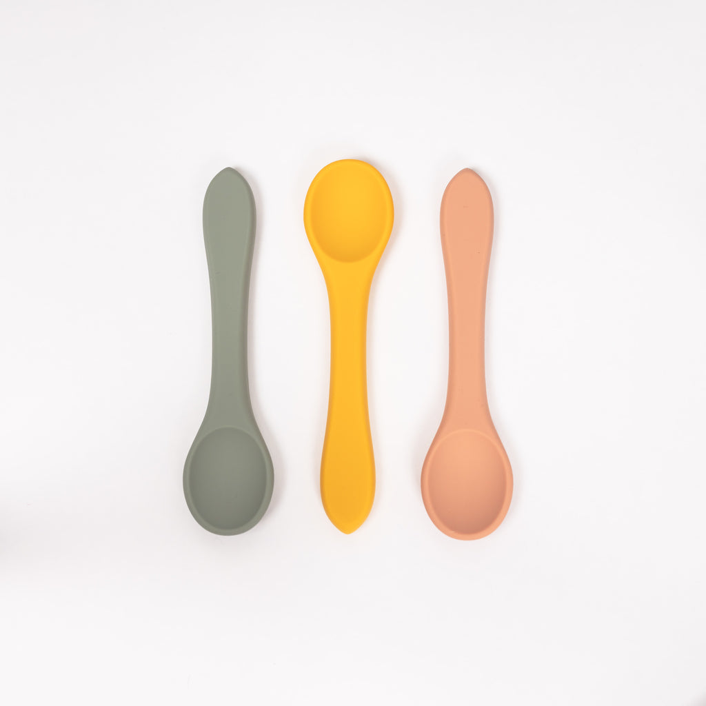 image of three 100% food grade silicone toddler sized spoons in mustard sage and terracotta