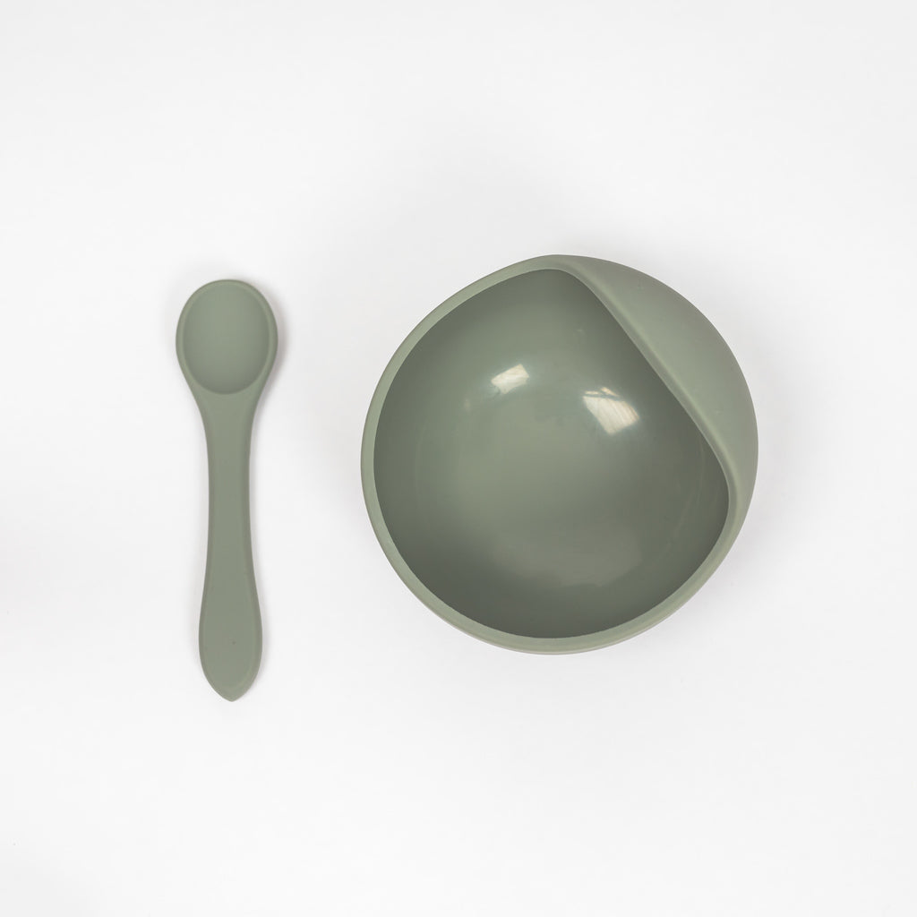 100% food grade silicone feeding set for infants and toddlers. Toddler sized spoon paired with a suction bowl in sage green