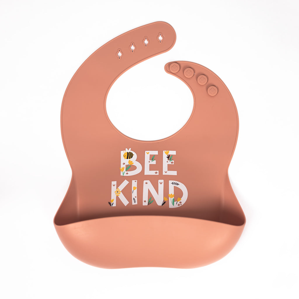 Safety tested silicone bib in terracotta with test bee kind in white with bees and flowers around text in yellow green and black.