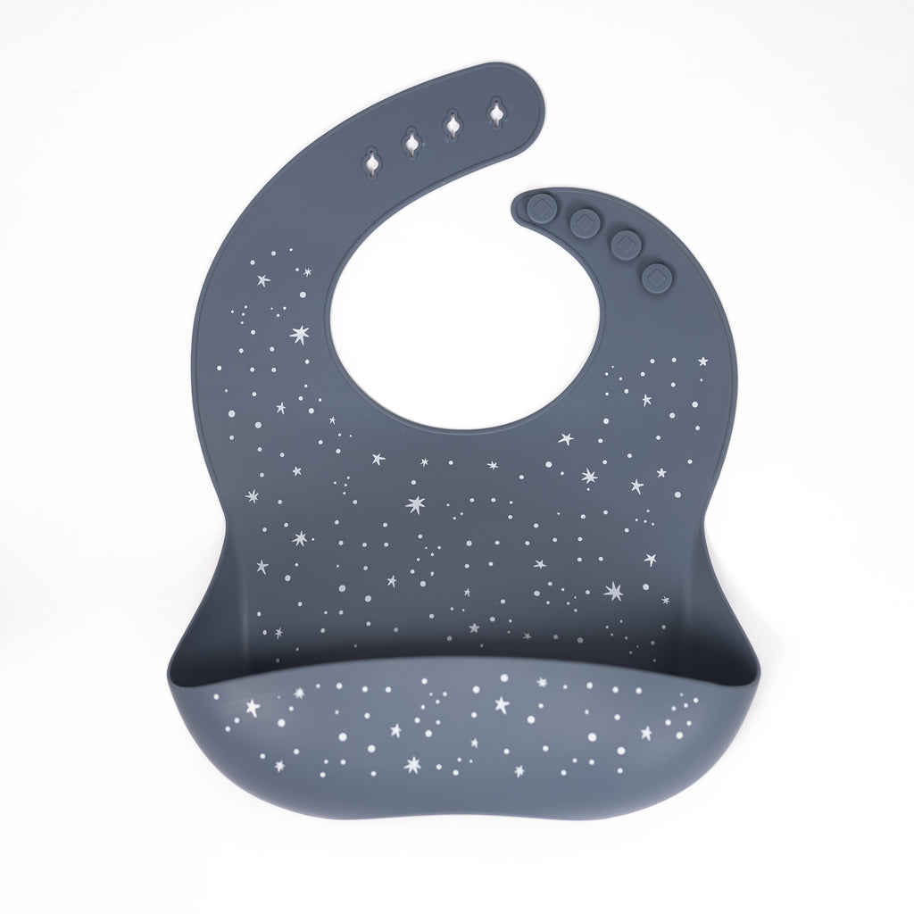 Safety tested silicone bib in slate blue with tossed twinkle stars in white.