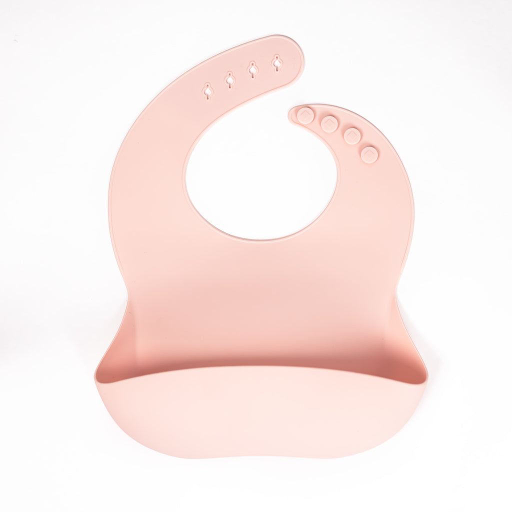 Safety tested silicone bib in blush. 