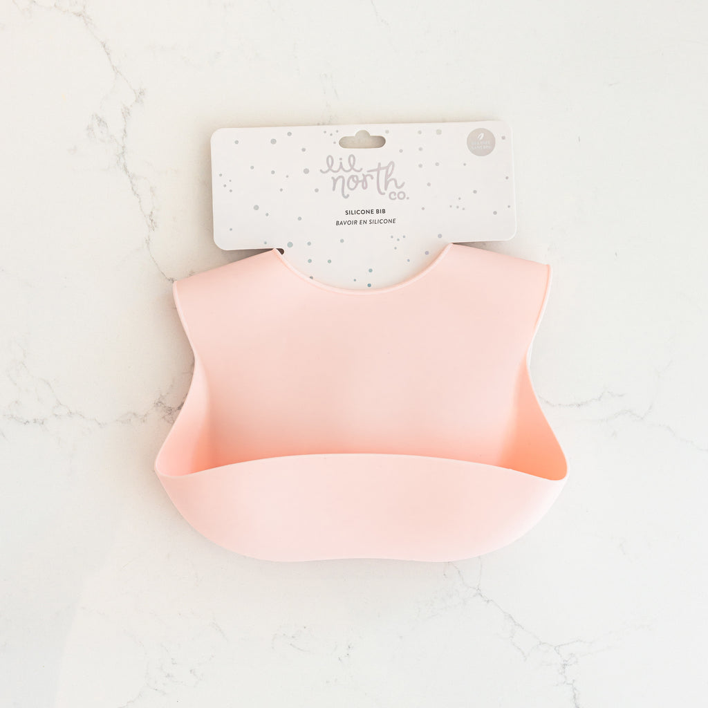 Safety tested silicone bib in blush. 