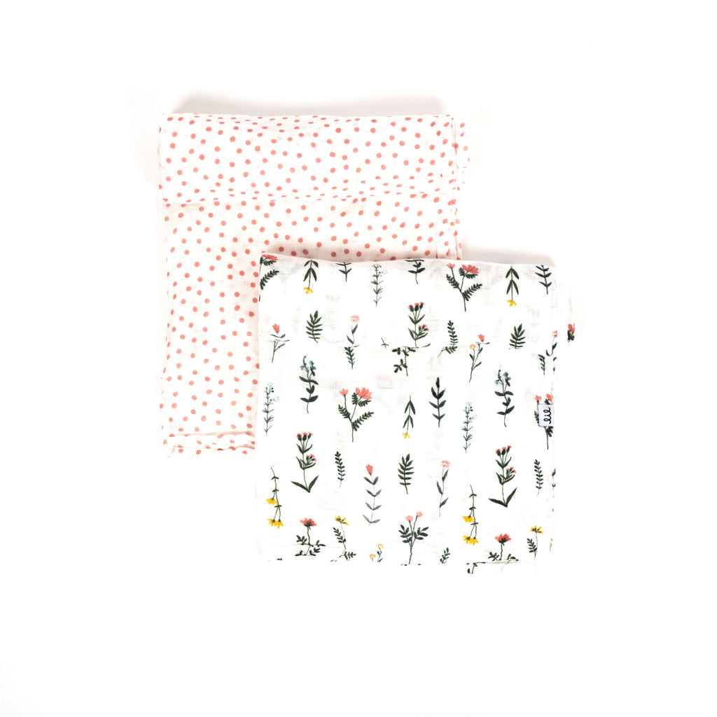 premium bamboo cotton muslin swaddle blanket set of two with one blush dot swaddle and one boho wildflower print