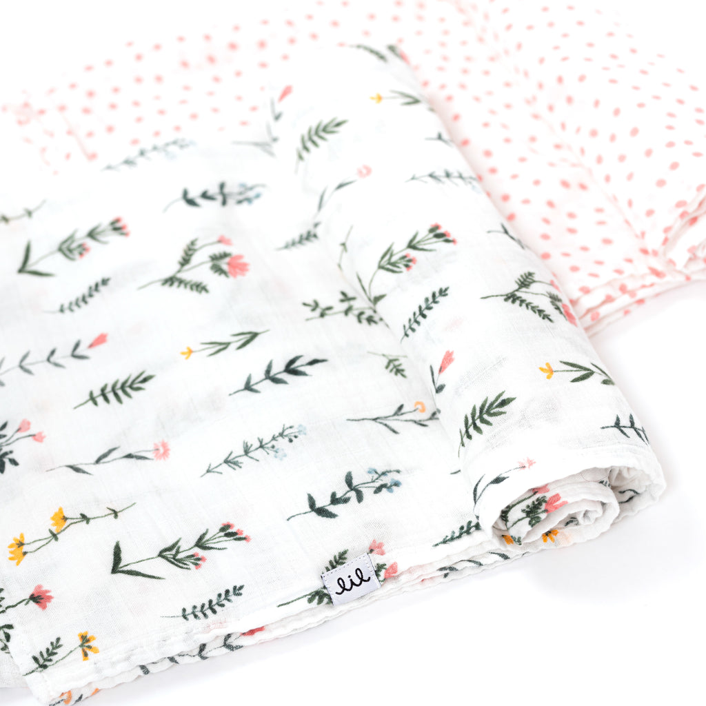 rolled swaddle blanket set with blush dot and wildflower print with yellow green blush and periwinkle