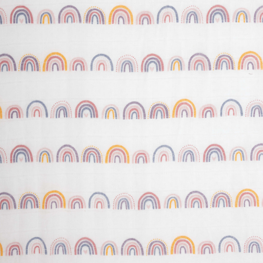 close up image of linear rainbow print colours are yellow mauve blush lavender and periwinkle on muslin crib sheet