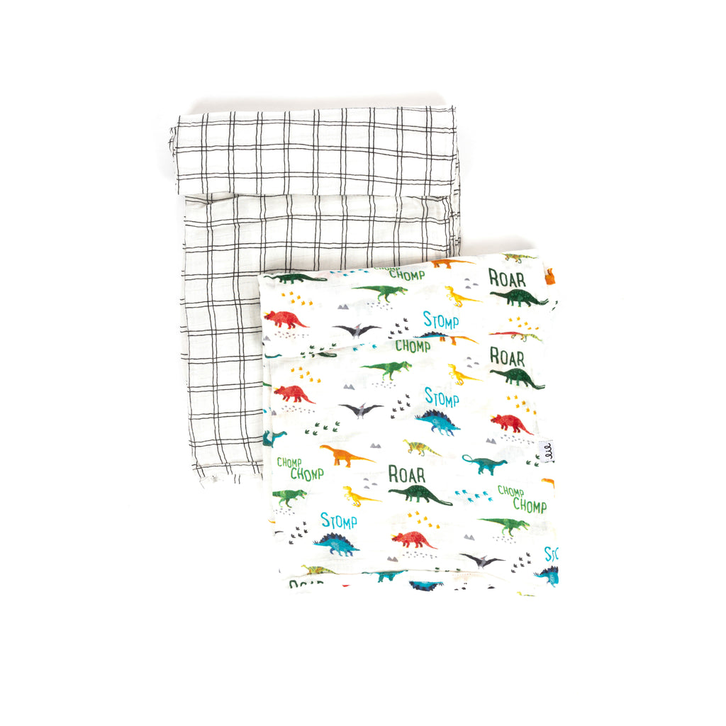premium bamboo cotton muslin swaddle blanket set with one bright coloured dino print with dinosaur names paired with a black and whit grid pattern