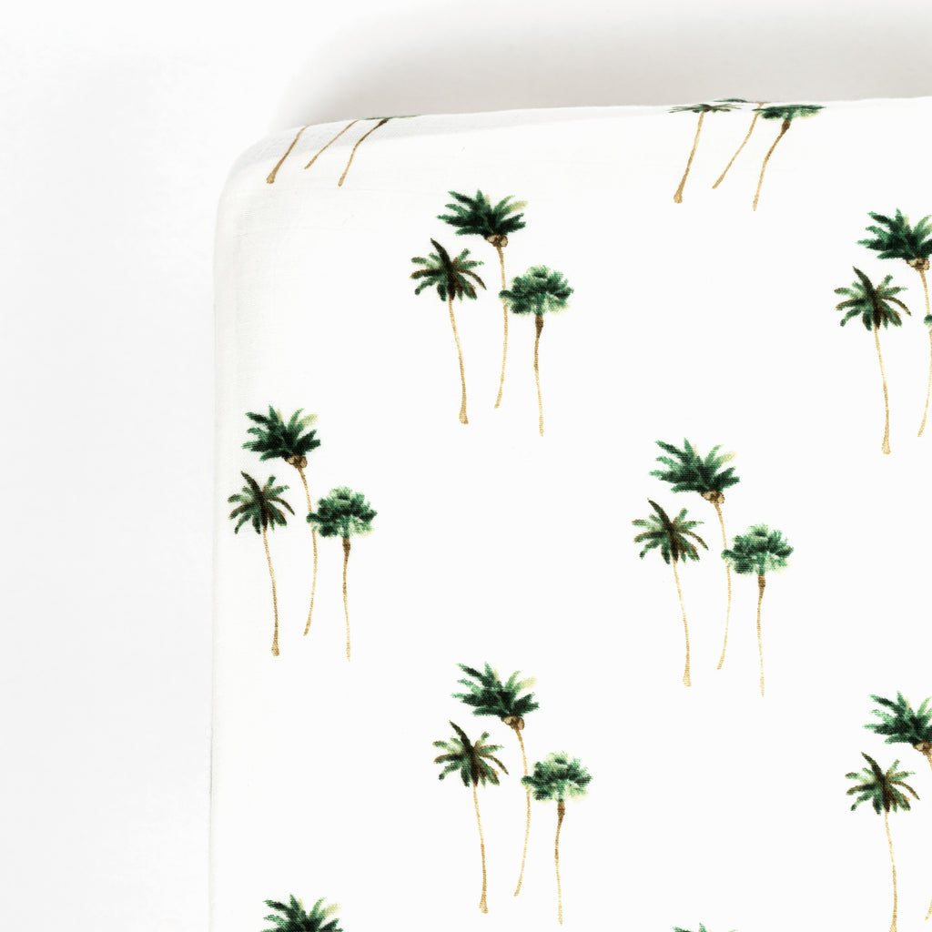 corner image of palm tree premium bamboo cotton muslin crib sheet