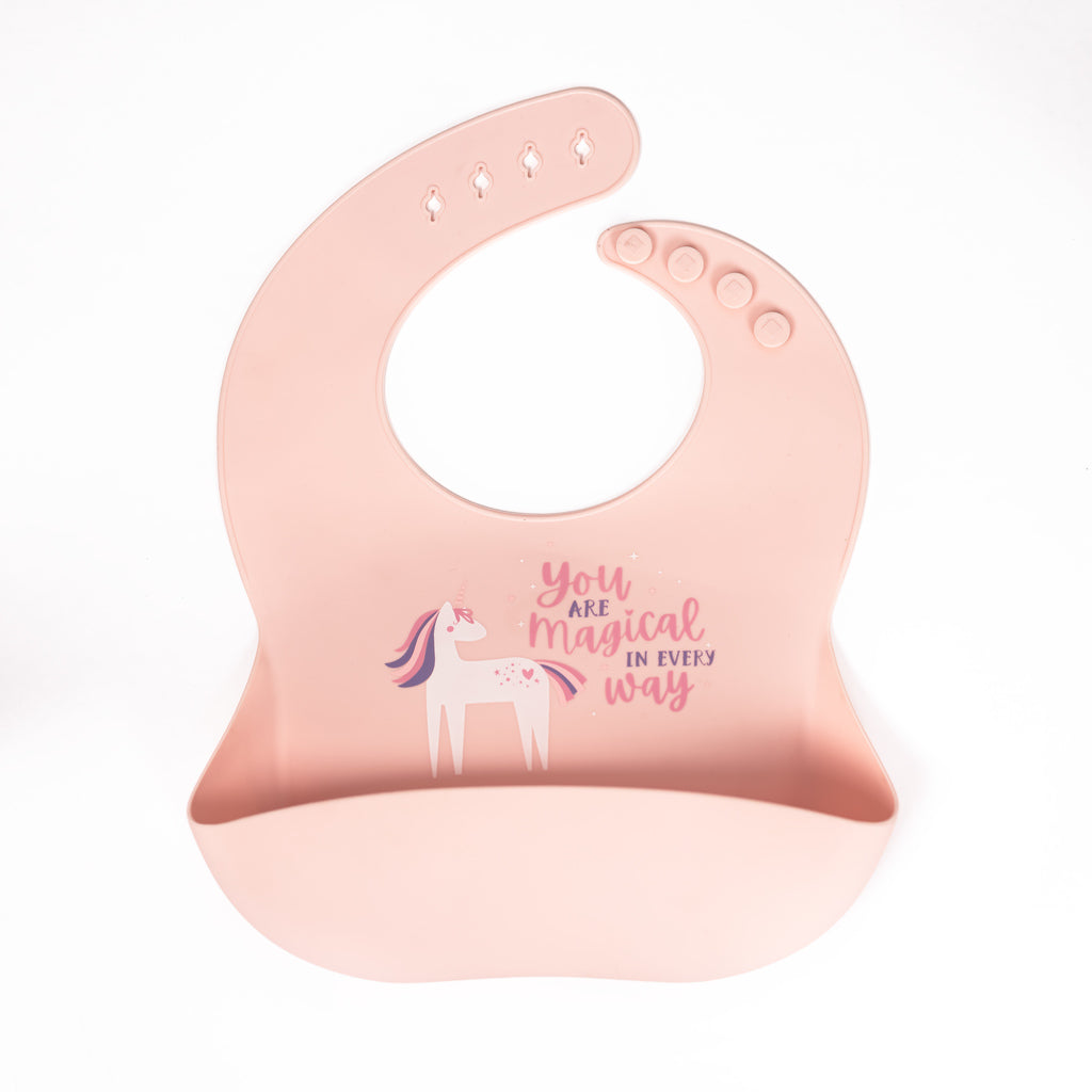 safety tested silicone bib in blush with text you are magical in every way beside a unicorn