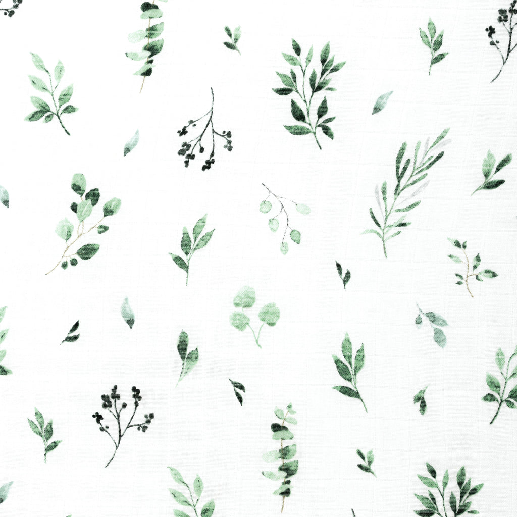 close up image of watercolour green and sage foliage muslin crib sheet