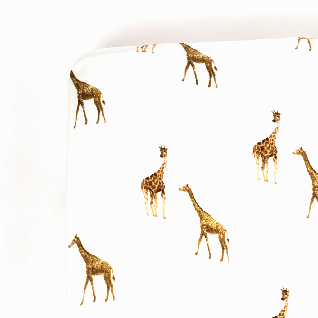 Corner image of Premium bamboo cotton muslin crib sheet with giraffe print